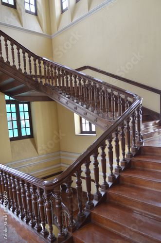 Winding wood staircase  in building