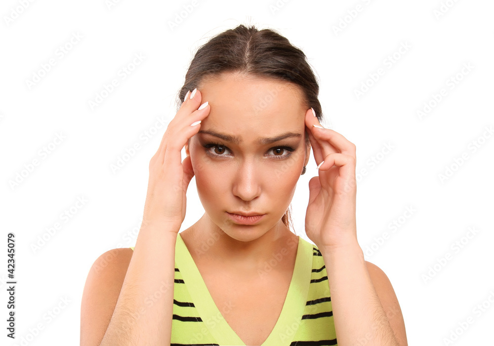 Woman with Migraine Headache holding hands to head Woman with Migraine Headache holding hands to head