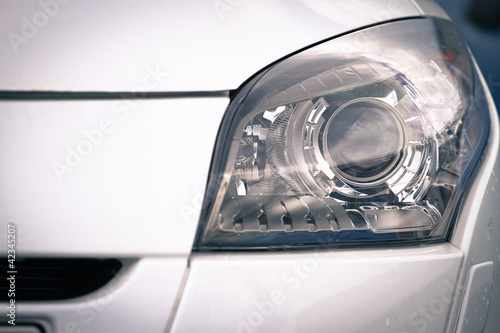 headlamp on luxury car © Lario Tus