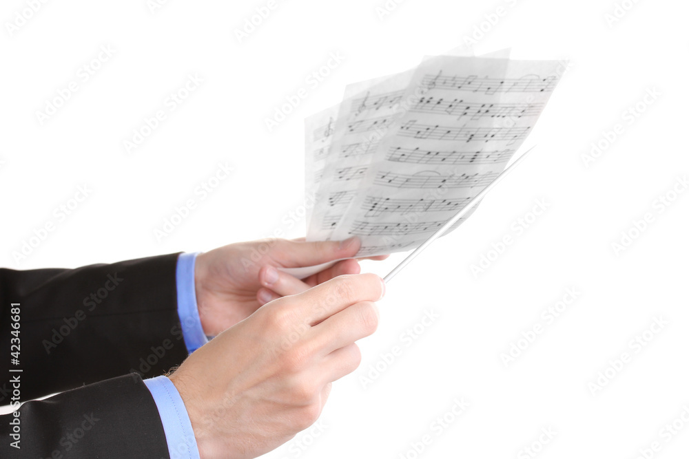 Fototapeta premium Music conductor hands with baton and notes isolated on white
