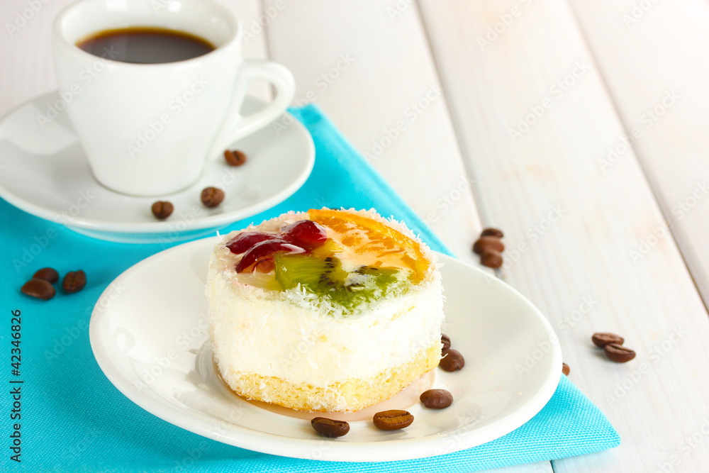 cup of coffee and sweet cakes with fruits on wooden table cup of coffee and sweet cakes with fruits on wooden table