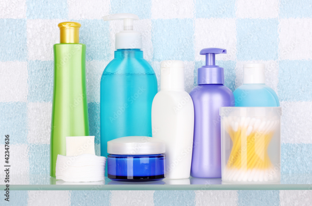 Shelf with cosmetics and toiletries in bathroom Shelf with cosmetics and toiletries in bathroom