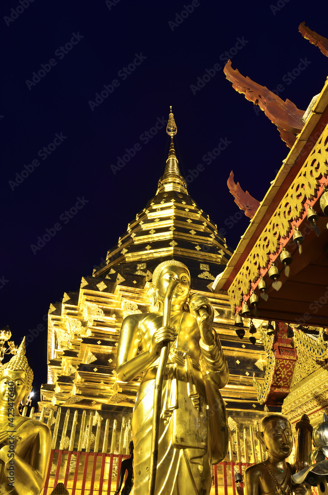 golden Pagoda and buddhist statue
