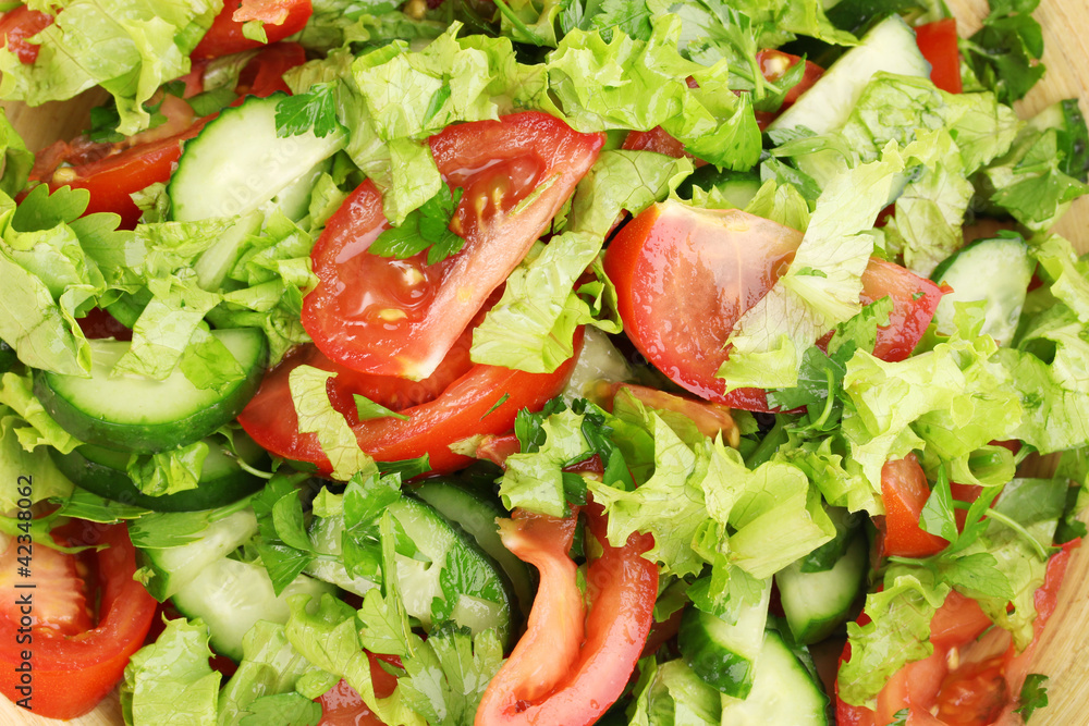 Fresh salad with tomatoes and cucumbers close-up Fresh salad with tomatoes and cucumbers close-up