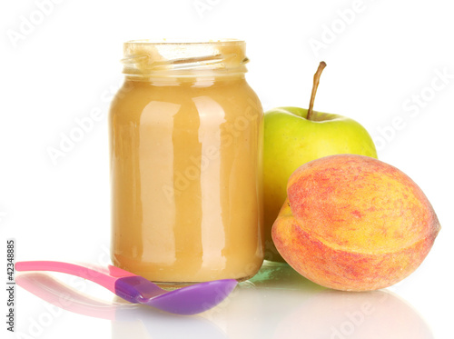 Jar with fruit baby food and spoon isolated on white