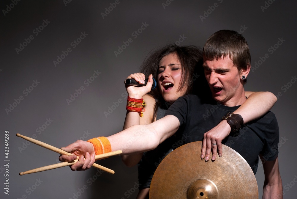 Fototapeta premium A girl and fellow is musicians