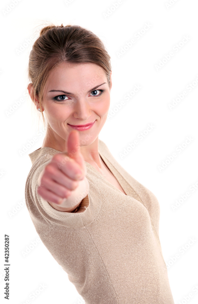 Beautiful young woman showing thumb up sign and smiling brightly Beautiful young woman showing thumb up sign and smiling brightly