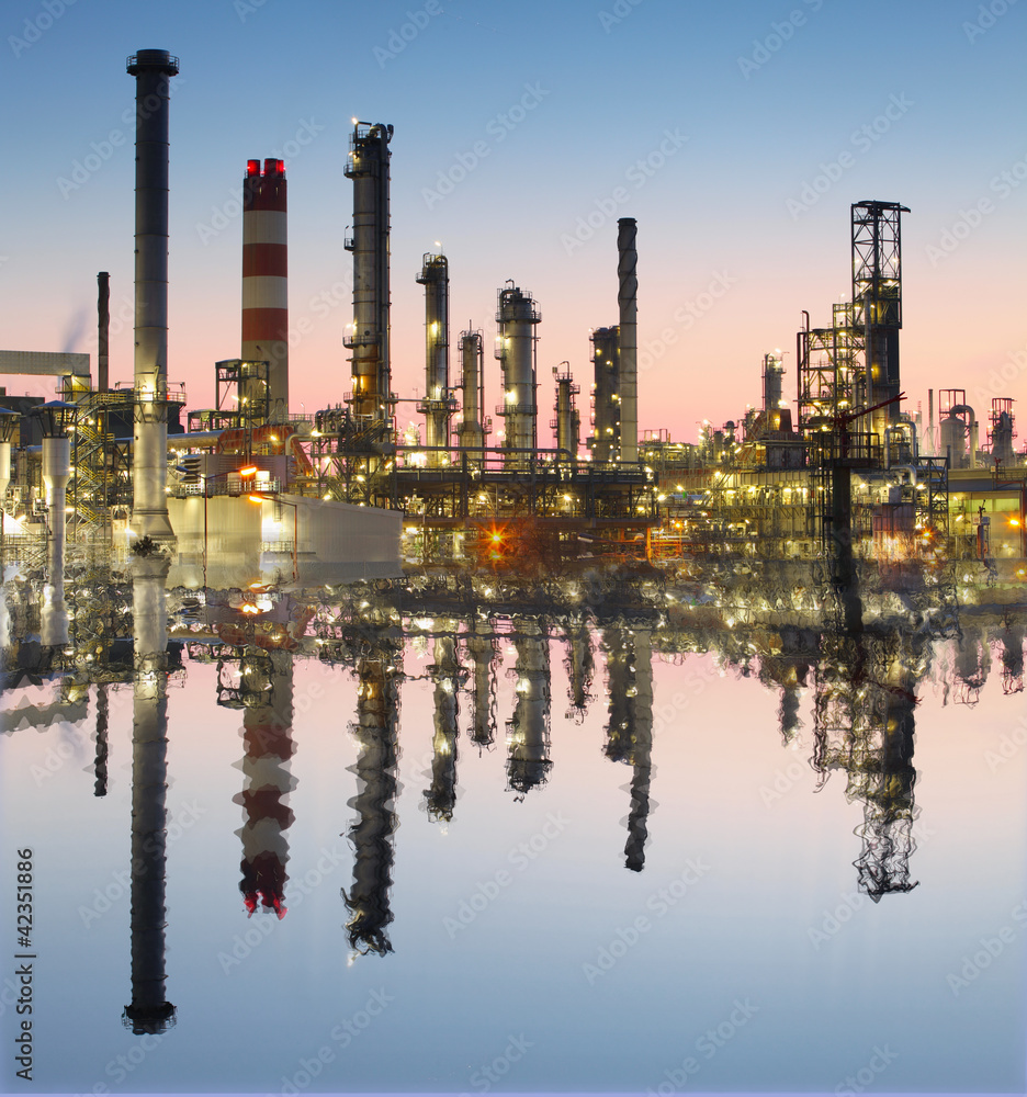 Oil and gas refinery with reflection in water