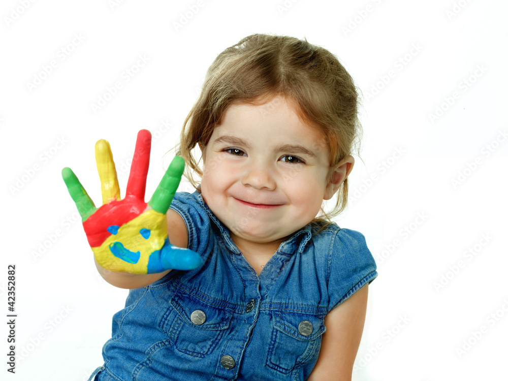 Little girl is proud of her coloured hand Little girl is proud of her coloured hand