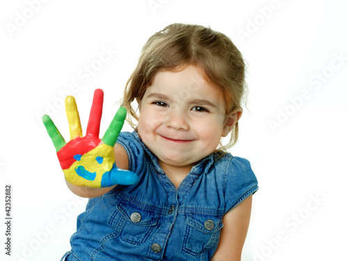 Little girl is proud of her coloured hand