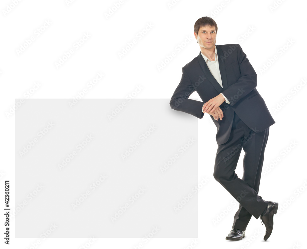 Portrait of young business man showing blank signboard Portrait of young business man showing blank signboard