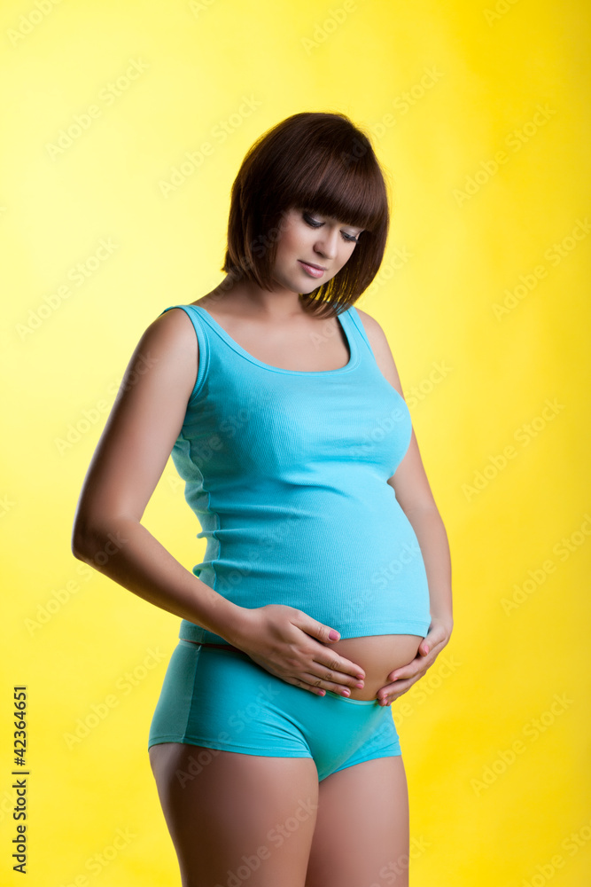 Pretty pregnant brunette young woman Pretty pregnant brunette young woman