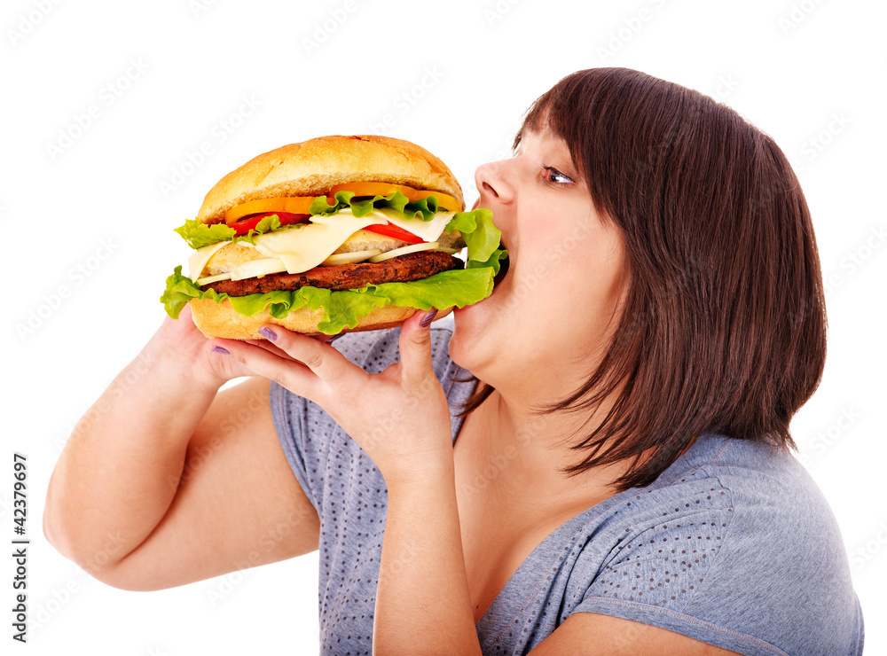 Woman eating hamburger.