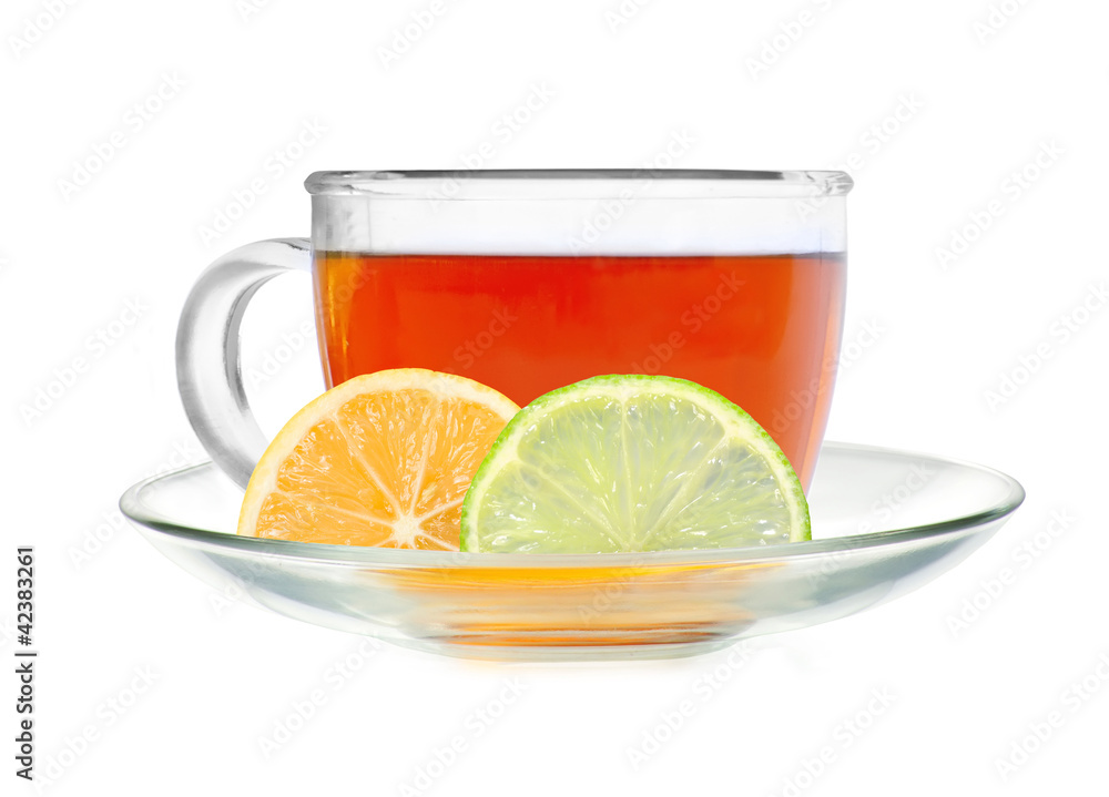 Glass cup tea with lemon and lime slices isolated on a white bac Glass cup tea with lemon and lime slices isolated on a white bac