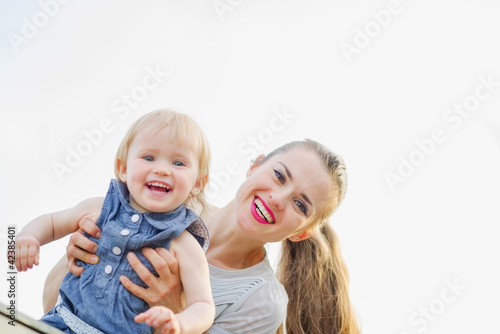 Portrait of smiling mother with kid