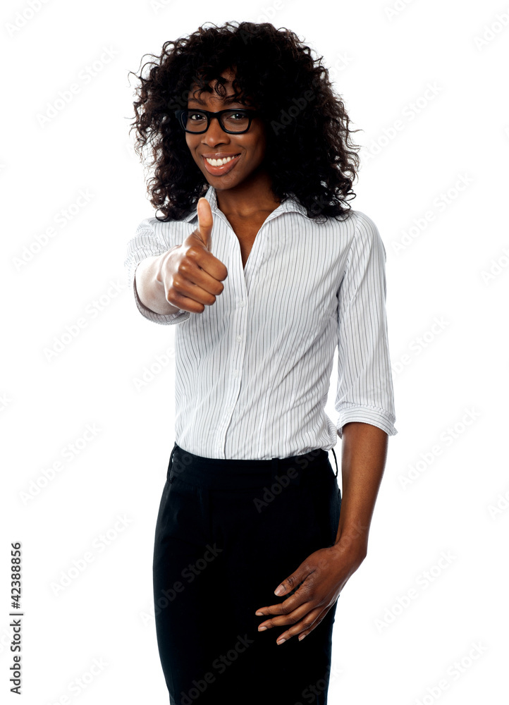 Confident woman showing thumbs up Confident woman showing thumbs up