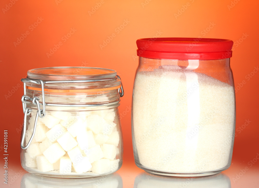 Jar with white crystal sugar and sugar-bowl with white lump Jar with white crystal sugar and sugar-bowl with white lump