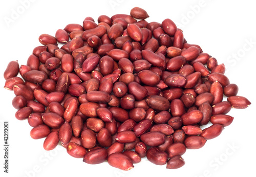 Peanuts with red skin isolated on white.