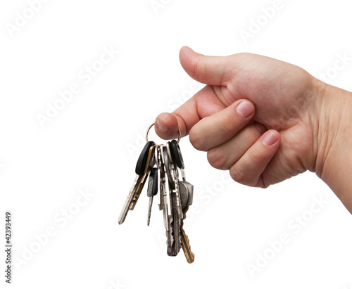 Fotografija Old rusty bunch of keys in hand. Isolated on white