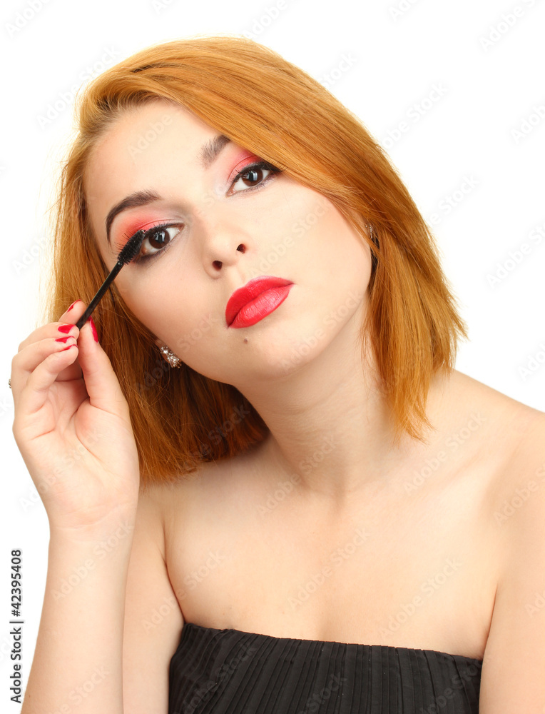 Beautiful young woman applying mascara on her eyelashes Beautiful young woman applying mascara on her eyelashes