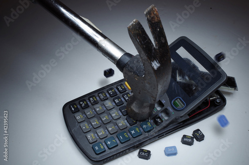 Hammer Smashing a Calculator