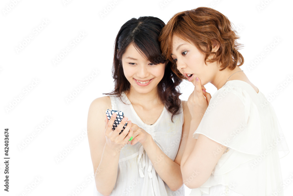 Beautiful young women using a mobile phone. Portrait of asian. Beautiful young women using a mobile phone. Portrait of asian.