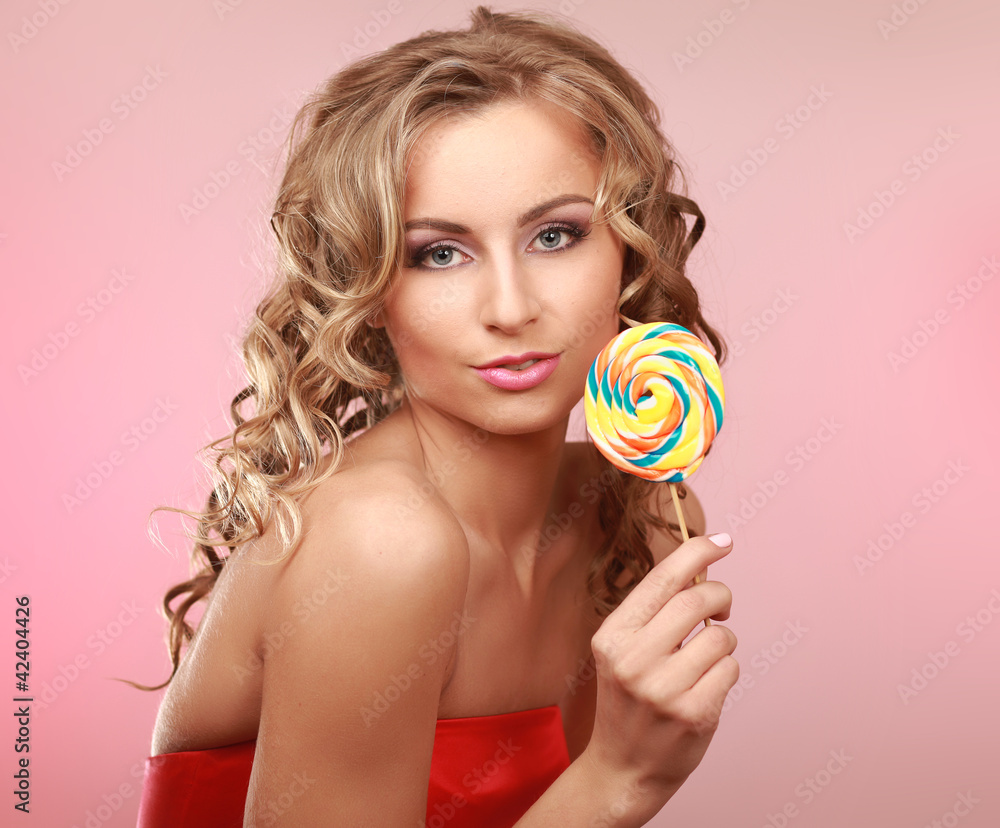 young happy woman with  lollipop