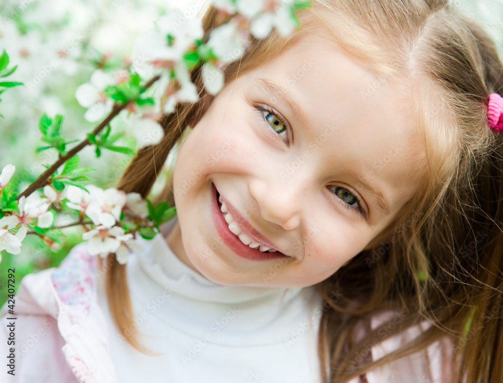 little girl with bush blossoming