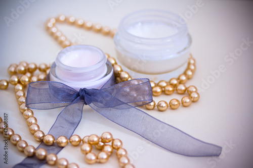 luxury spa products and gold necklace, with vignette