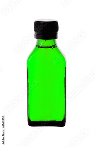 Close up of medicine bottle with green syrup isolated on white b