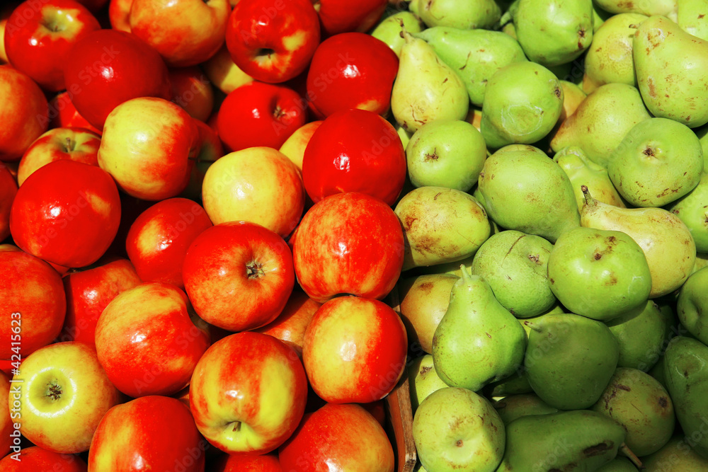 lot of apples and pears on counter lot of apples and pears on counter