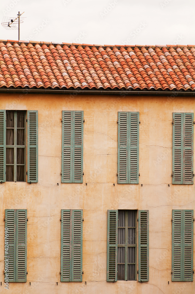 french house with windows and shutters