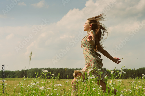 Girl running the meadow