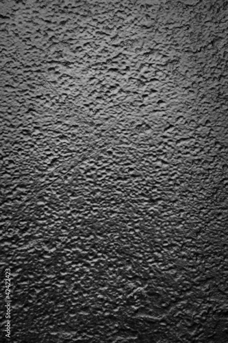 Background of textured metal painted black