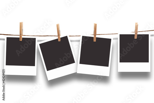 Poloroid hanging against white background