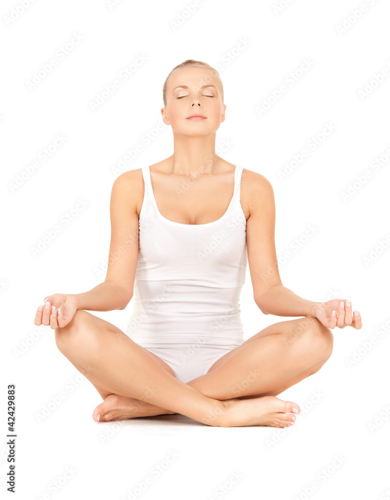 woman in undrewear practicing yoga lotus pose woman in undrewear practicing yoga lotus pose