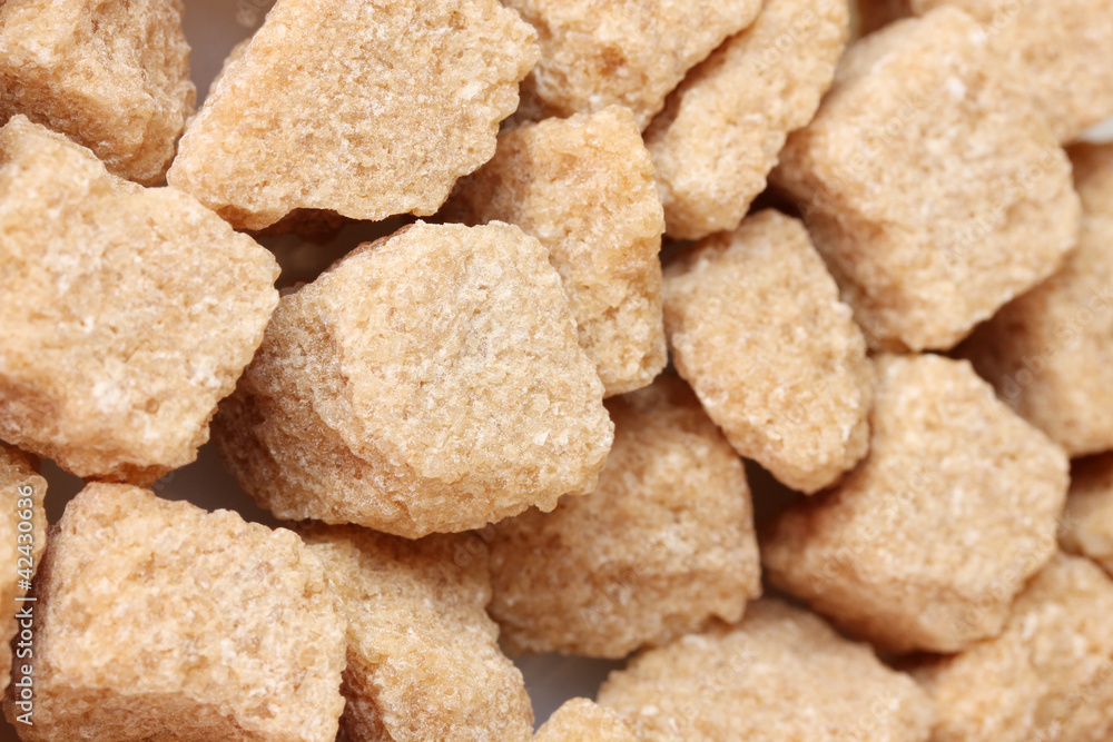 brown cane sugar cubes background close-up brown cane sugar cubes background close-up