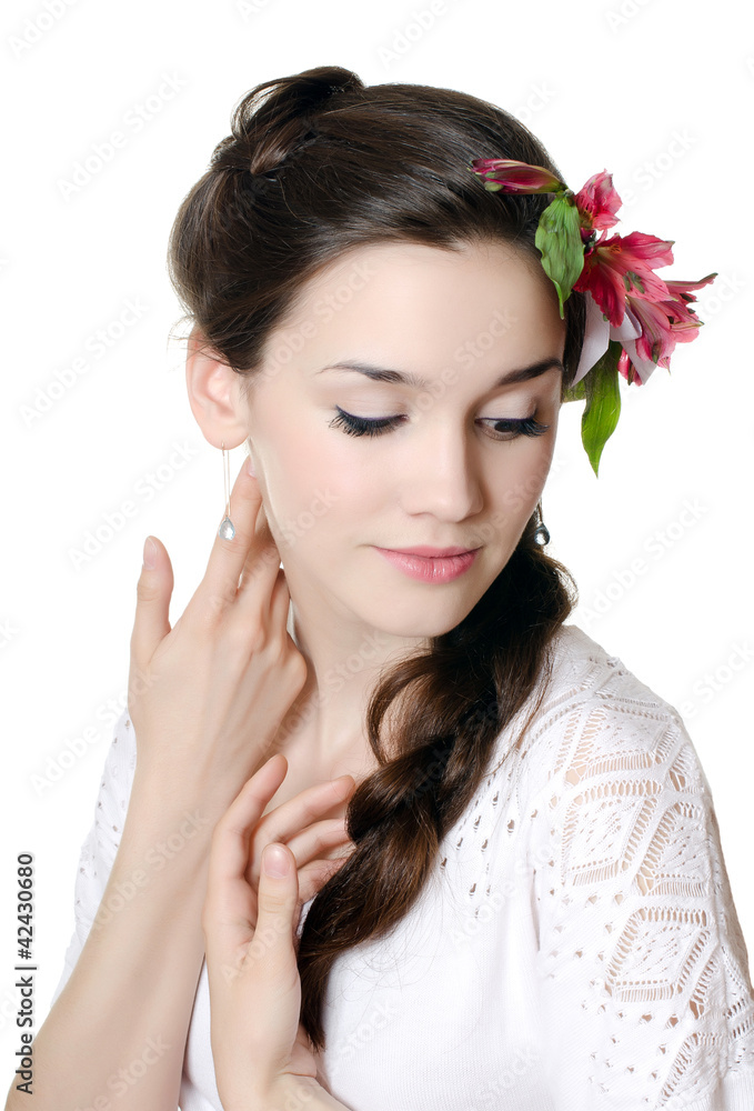 Fototapeta premium Portrait of the beautiful girl with flowers in hair