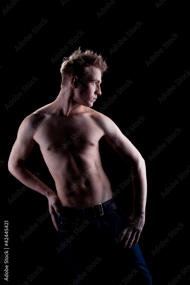 Naklejka premium Sexy young man in jeans