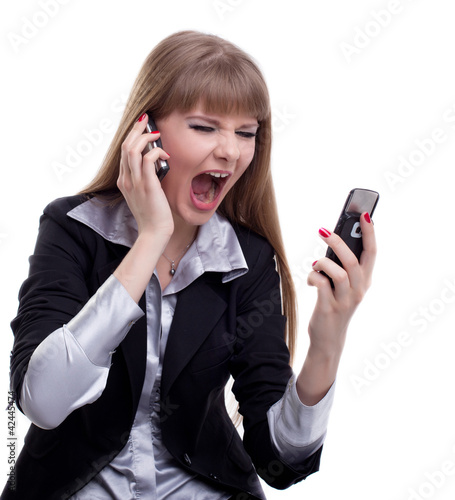Stressed business woman with two cell phones