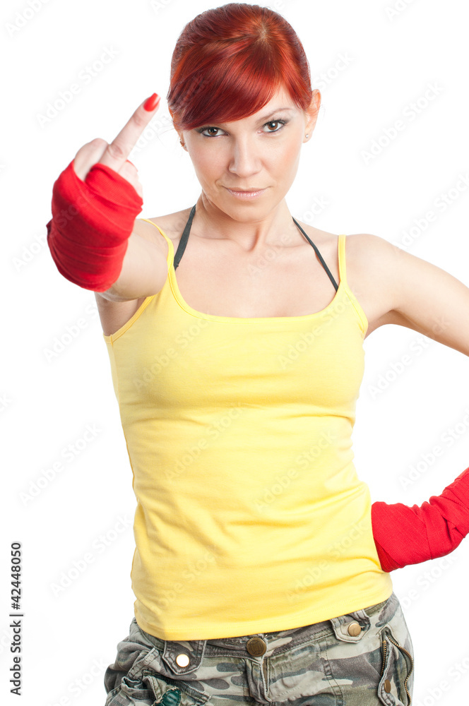 Sportive young woman in boxing bandage showing middle finger Sportive young woman in boxing bandage showing middle finger