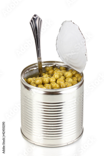 Open tin can of peas with spoon isolated on white