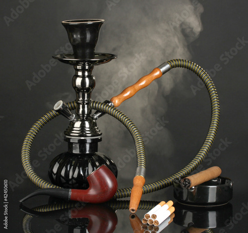 Smoking tools - a hookah, cigar, cigarette and pipe