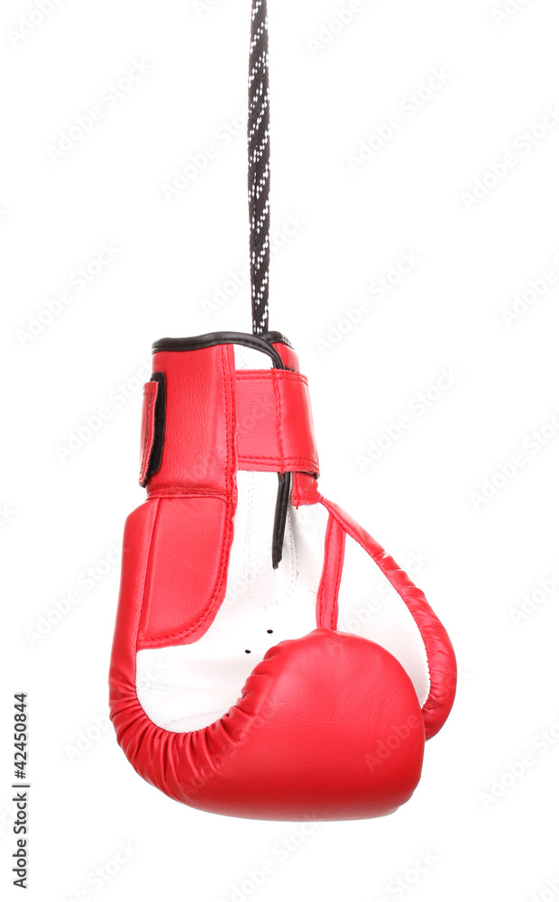 Red boxing glove hanging isolated on white