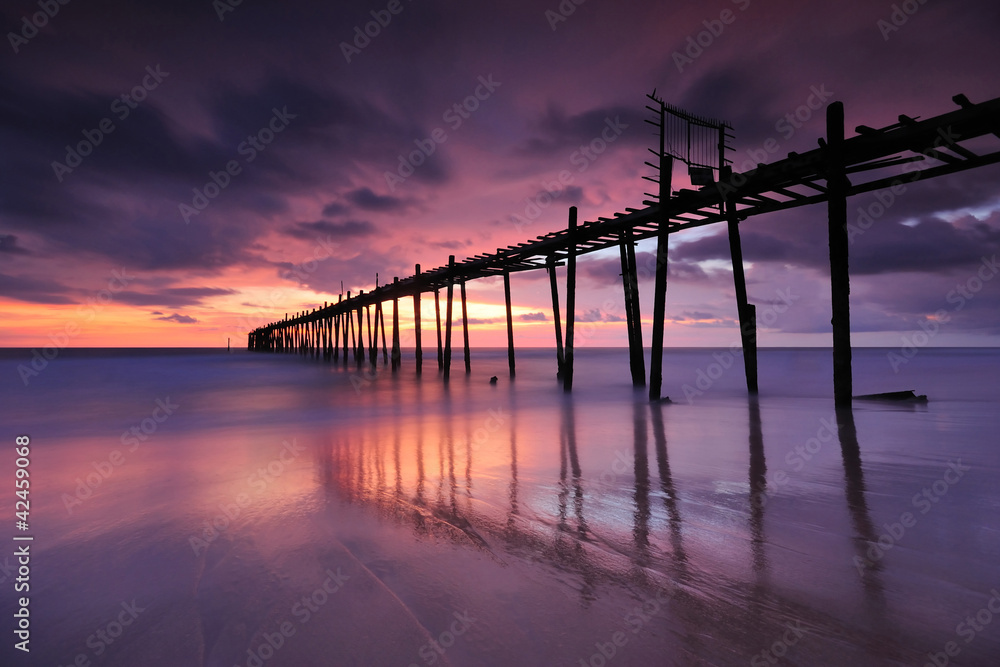 wooden bridge into the sea