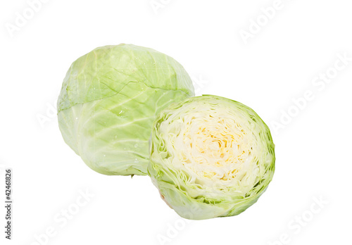 The head of green cabbage is whole and half