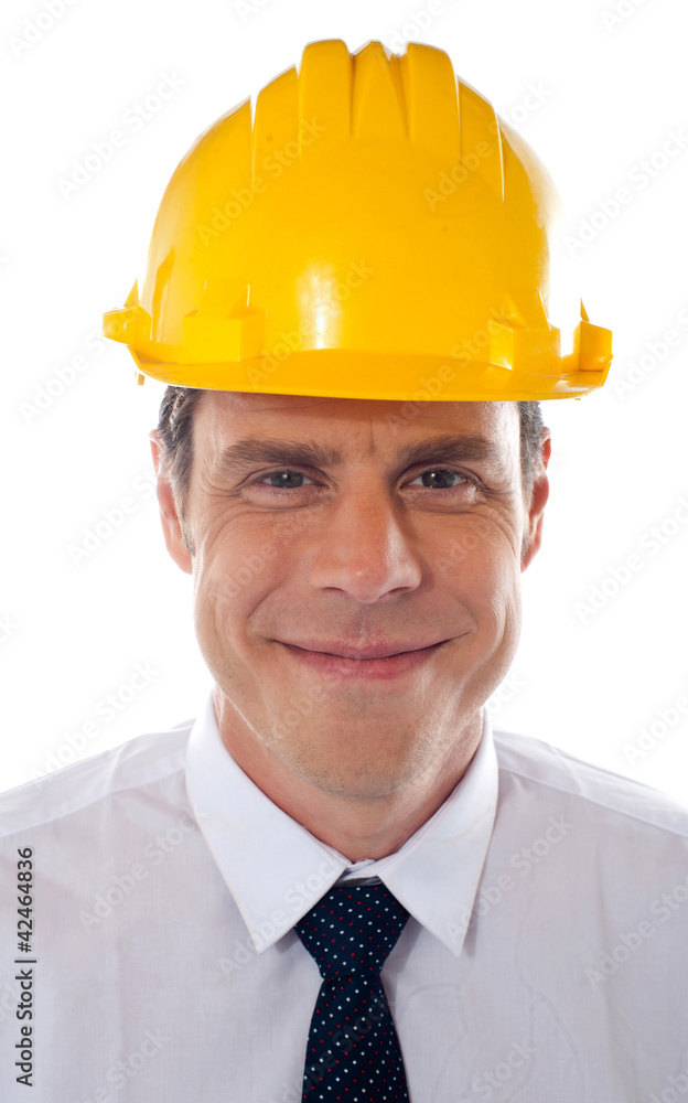 An architect wearing yellow safety helmet An architect wearing yellow safety helmet