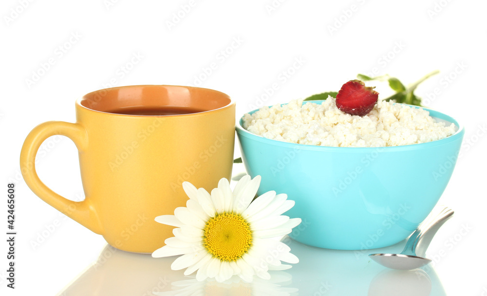 cottage cheese with strawberry in blue bowl and orange cup with