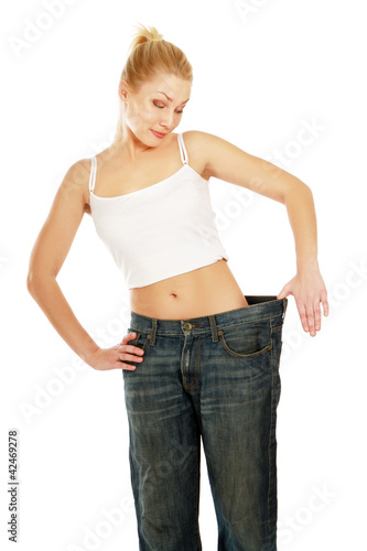 close-up of beautiful young female's body in old jeans