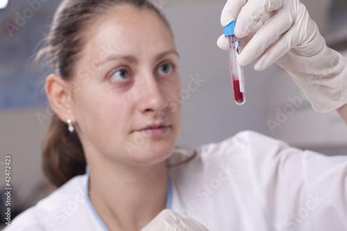Holding test tube full of blood